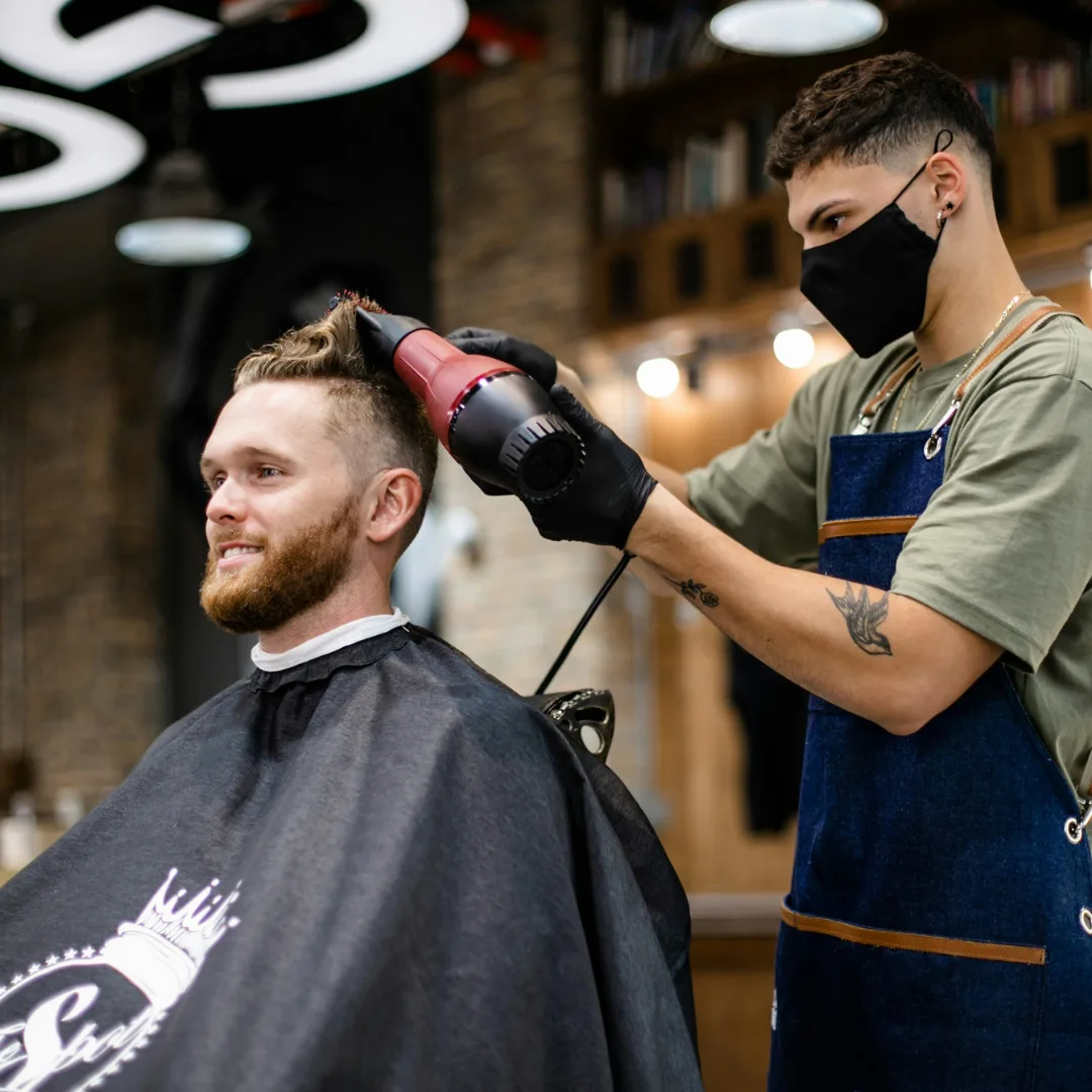 Barber at work in his shop