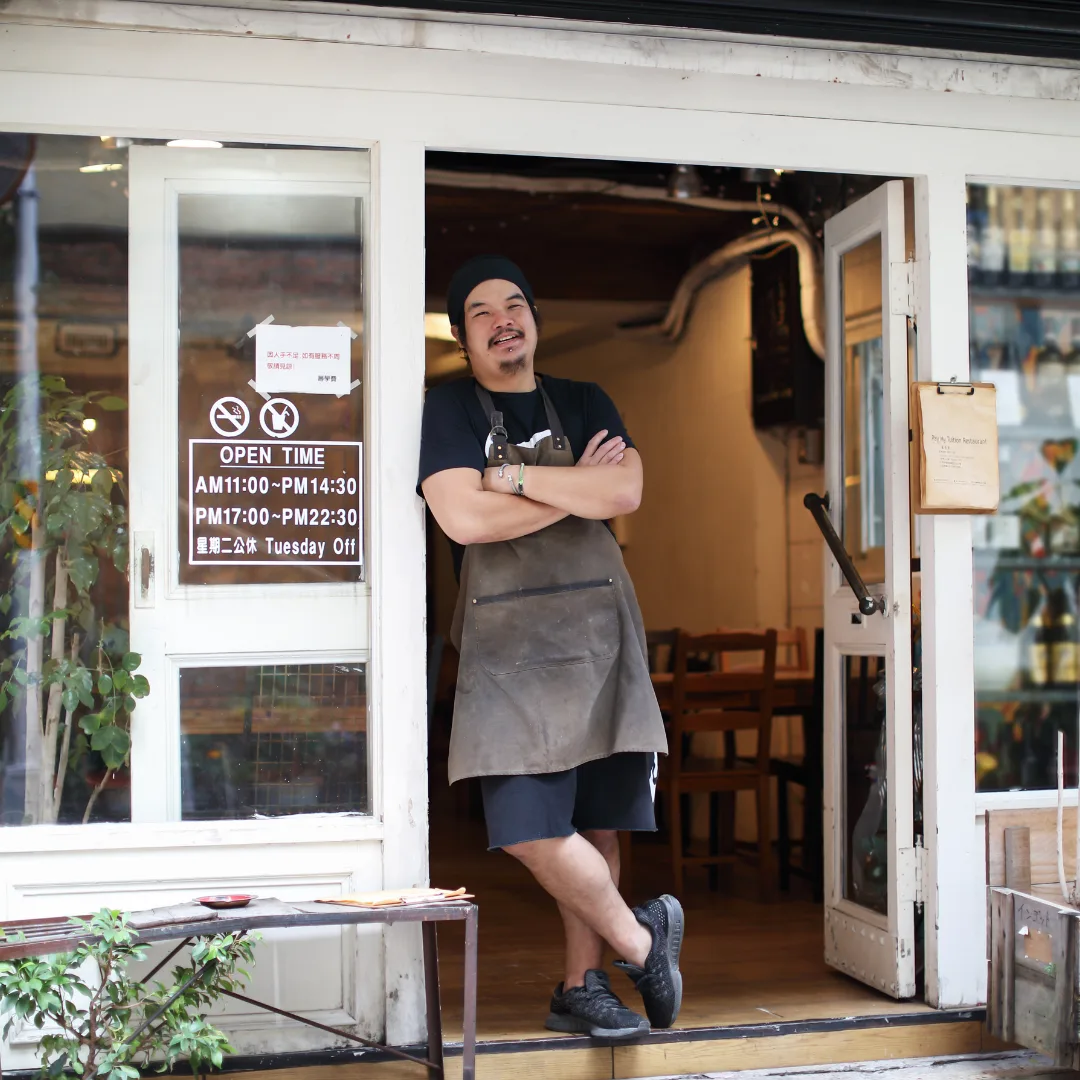 Local business owner at their doorway
